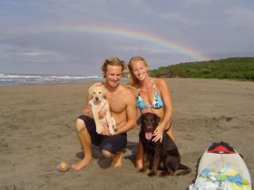 Lance and Kristin Moss with their dogs on the tranquili beach,  Playa Guasacate, in Popoyo , north of San Juan del Sur, Nicaragua – Best Places In The World To Retire – International Living